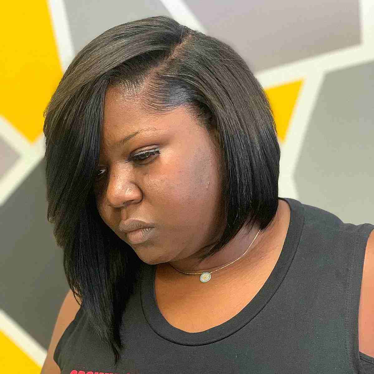 Multi-Layered Asymmetrical Bob Cut for a Black Woman Over 40