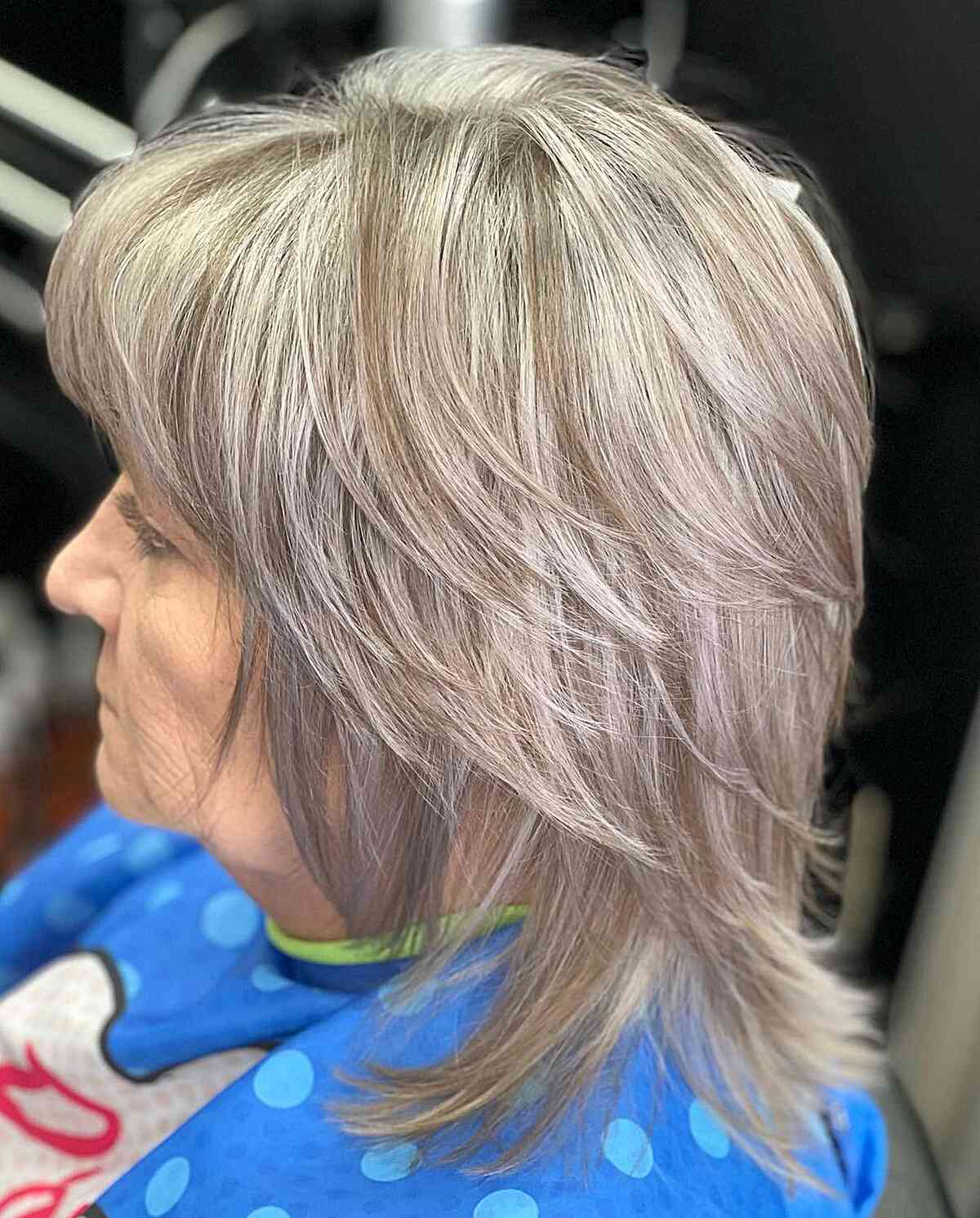 Multi-Layered Straight Haircut with Silver Highlights for Older Ladies Aged 60 with Medium Cut