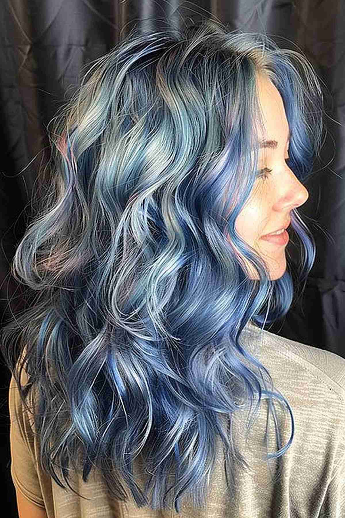 Wavy medium-length hair with gradient of blue shades from deep ocean to sky blue