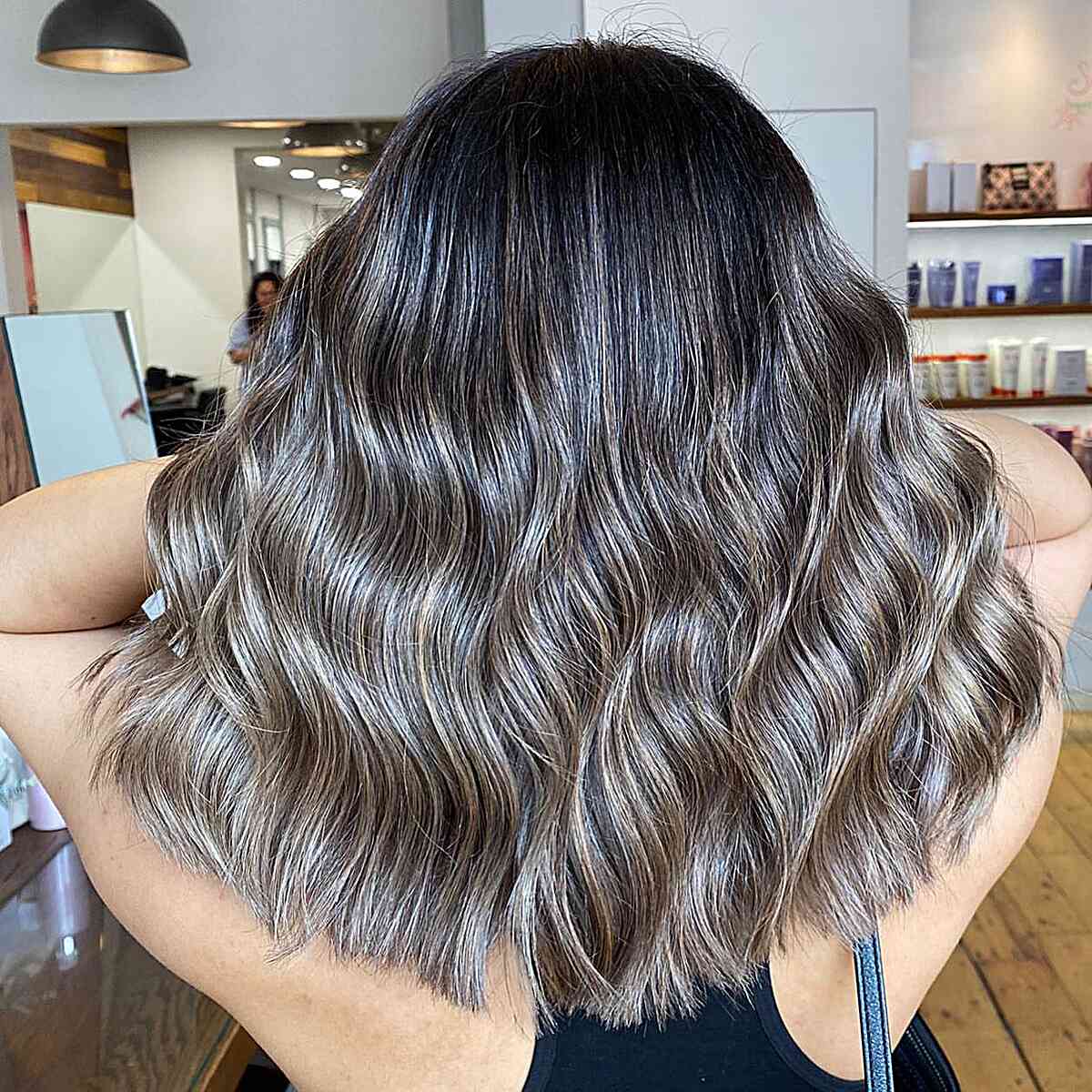 Mid-Length hair with Mushroom Brown Balayage and Hints of Blonde on Black Hair