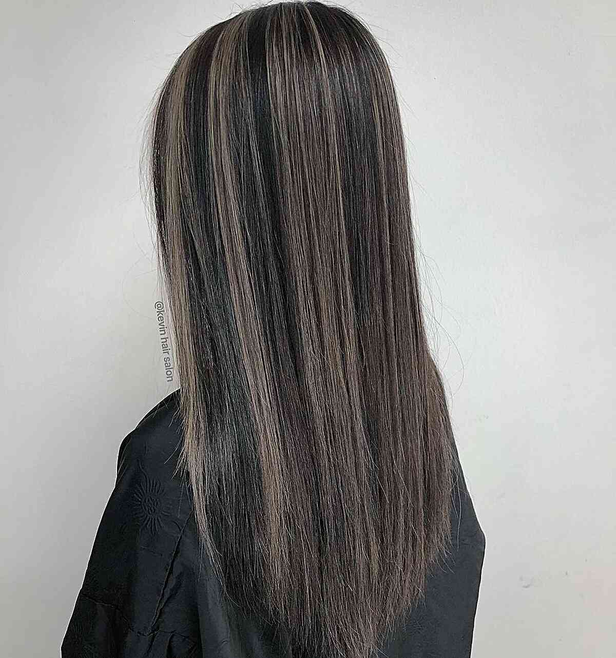 Muted Blended Grey Streaks on Long-Length Black Hair