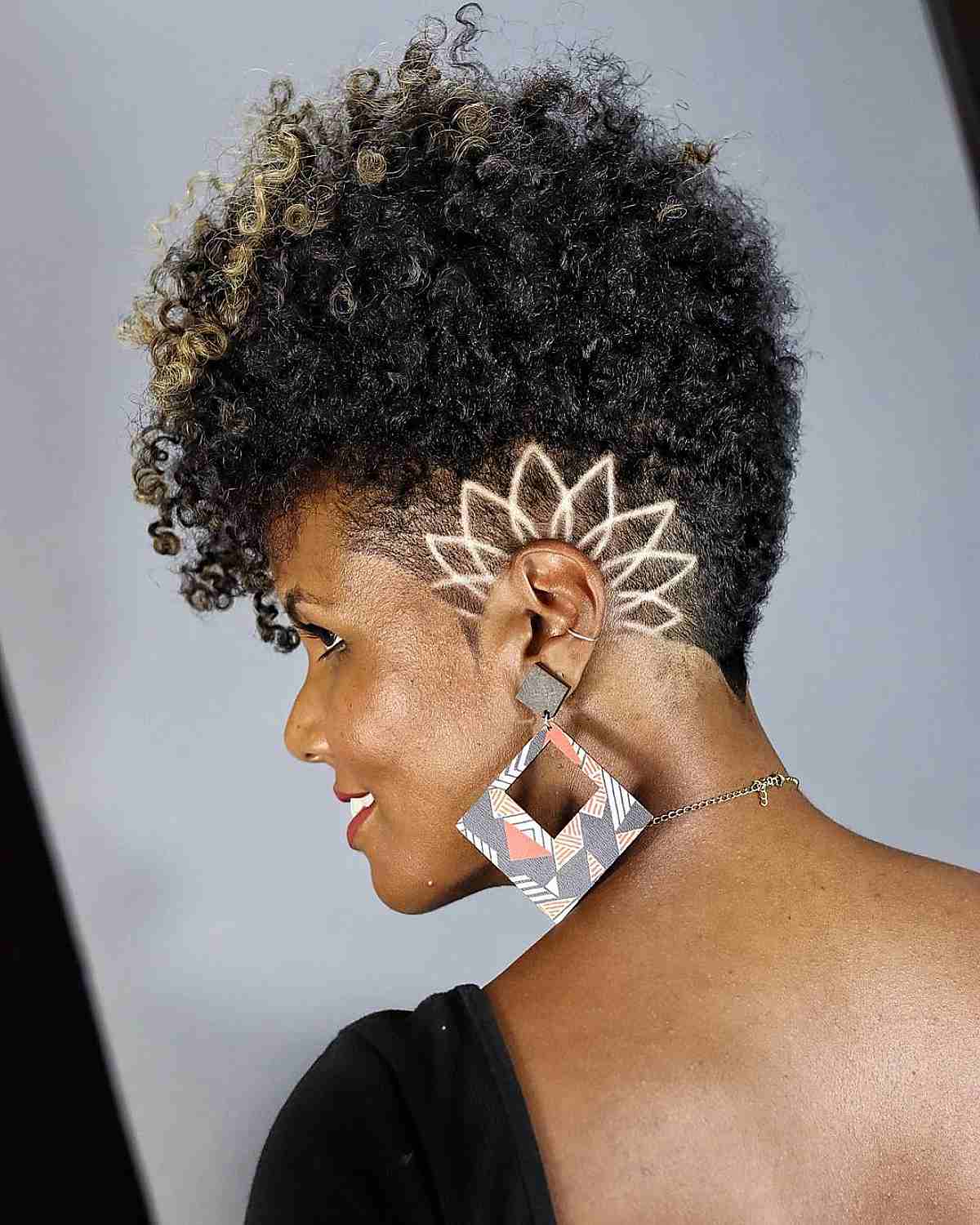 Natural Afro with Shaved Side Designs