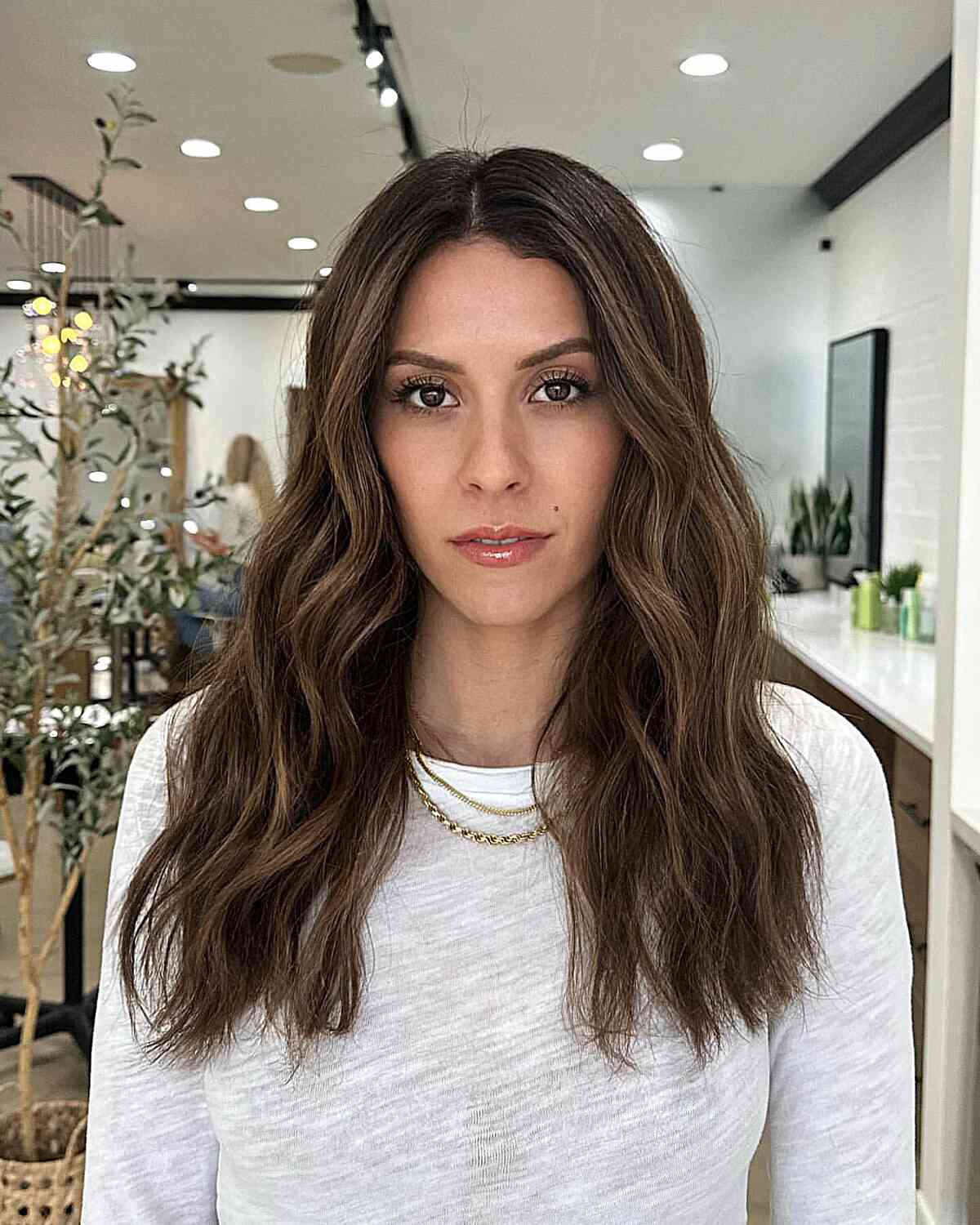 Natural and Soft Chocolate Balayage for Mid-Back Brunette Waves with Choppy Ends