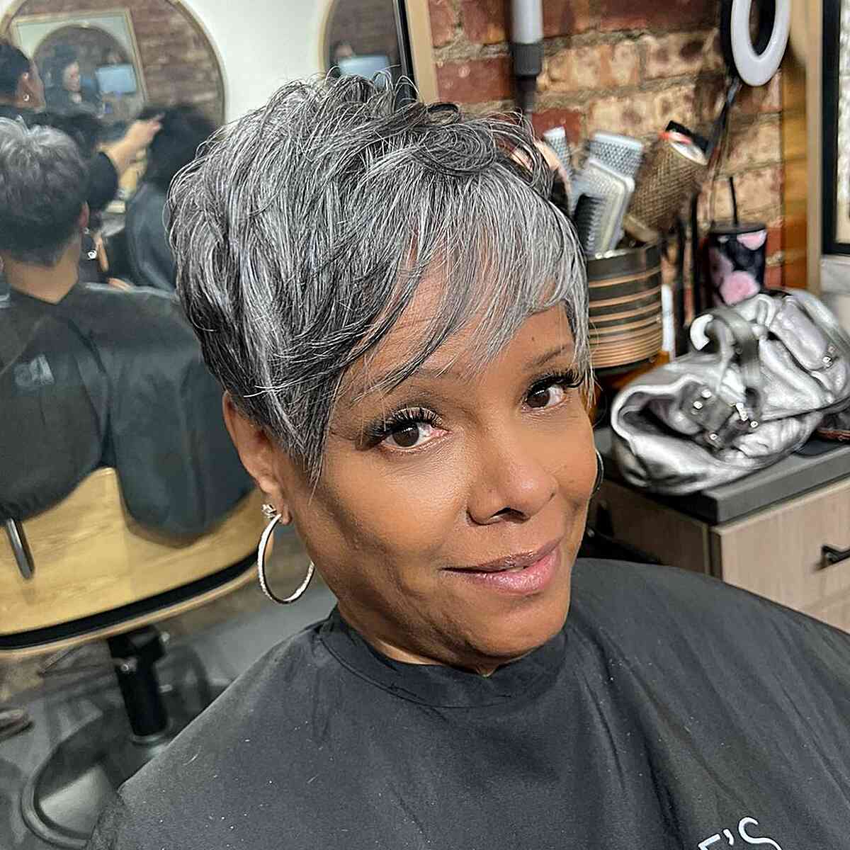 Natural Grey Pixie with Soft Sweeping Bangs for Black Women Aged 50