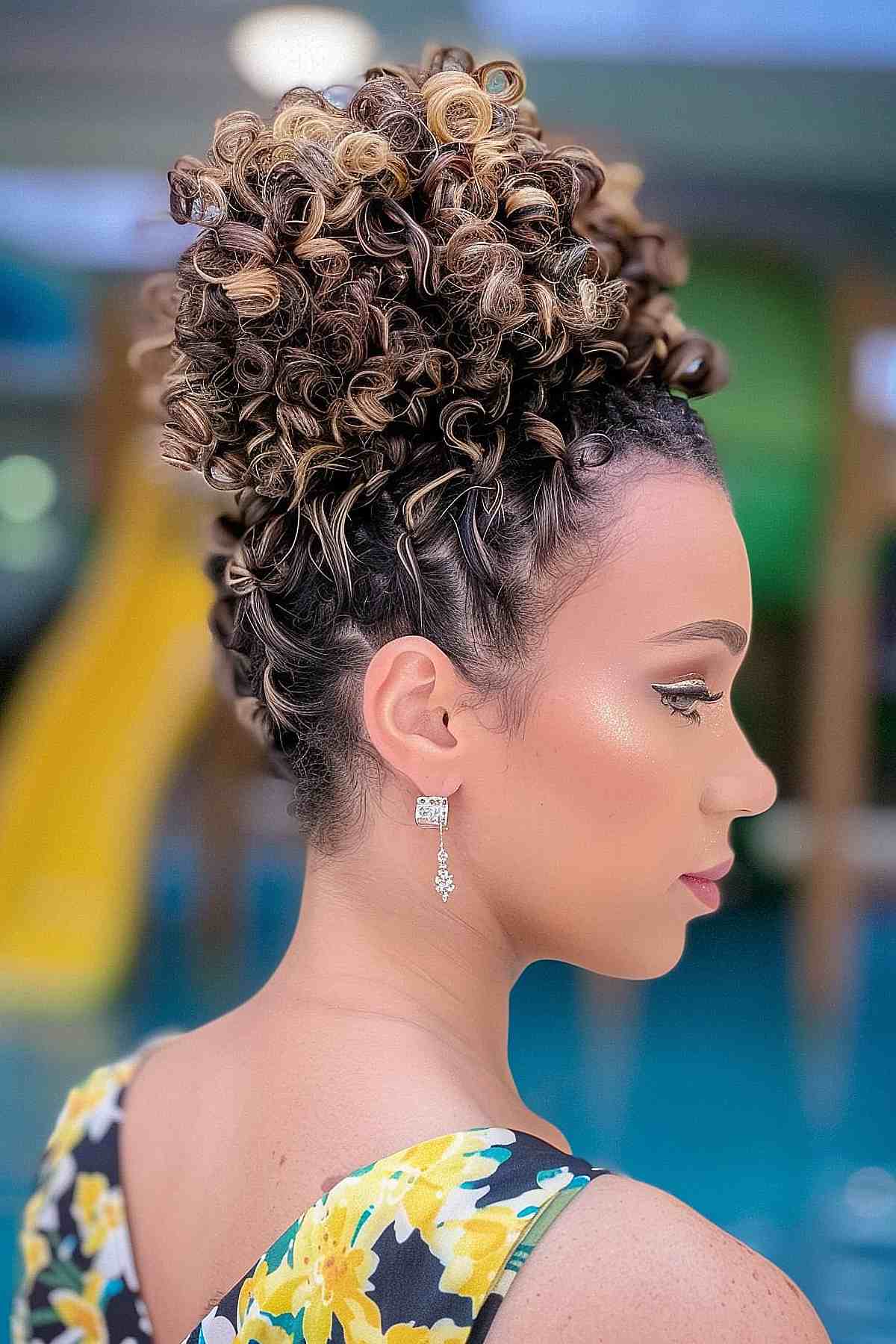 Side view of a woman with a pineapple updo, ideal for natural curly hair and a secure style for the waterpark