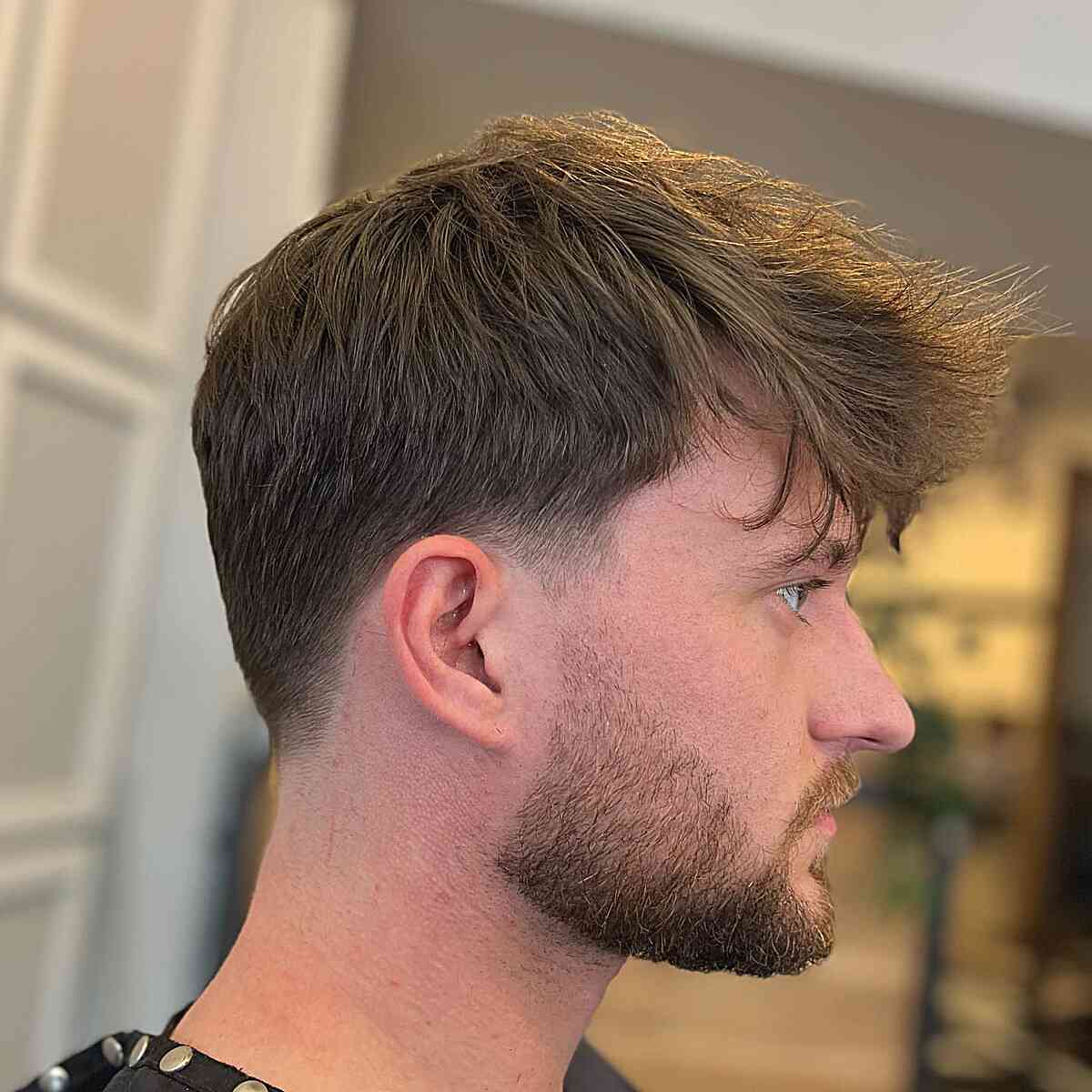 Natural Messy Top with Low Taper Fade for Men with Straight Locks