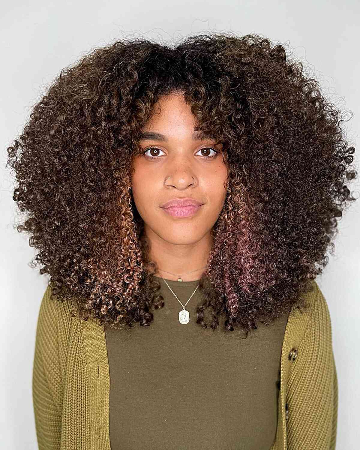 Natural Rezo Cut-Inspired Voluminous Curls with a Middle Part for Black Women