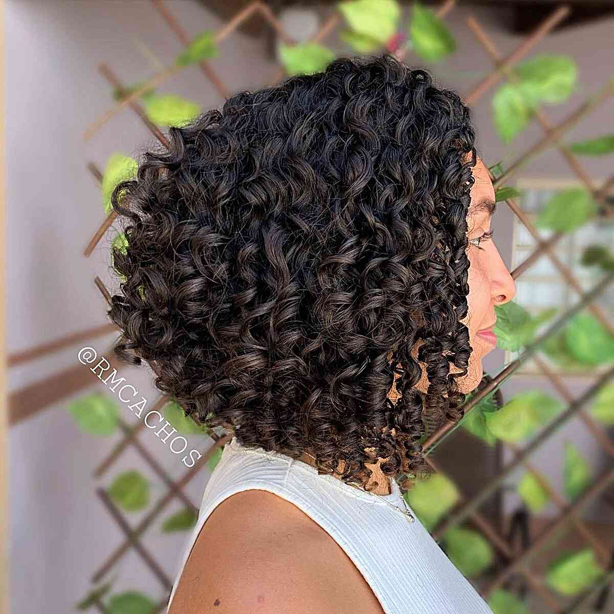 Neck-Grazing Curly Stacked Inverted Bob for Thick Hair