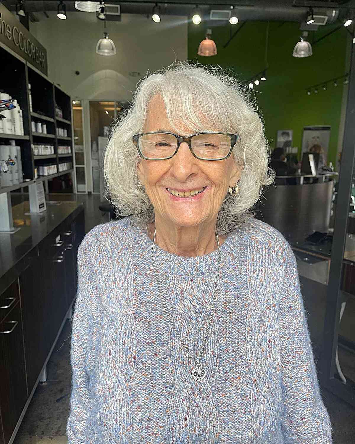 Neck-Grazing Natural Wavy Bob with Swept Bangs for Grandmothers Over 70