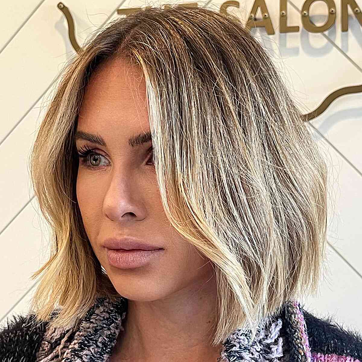 Neck-Grazing Rooted Blonde Blunt Bob Cut