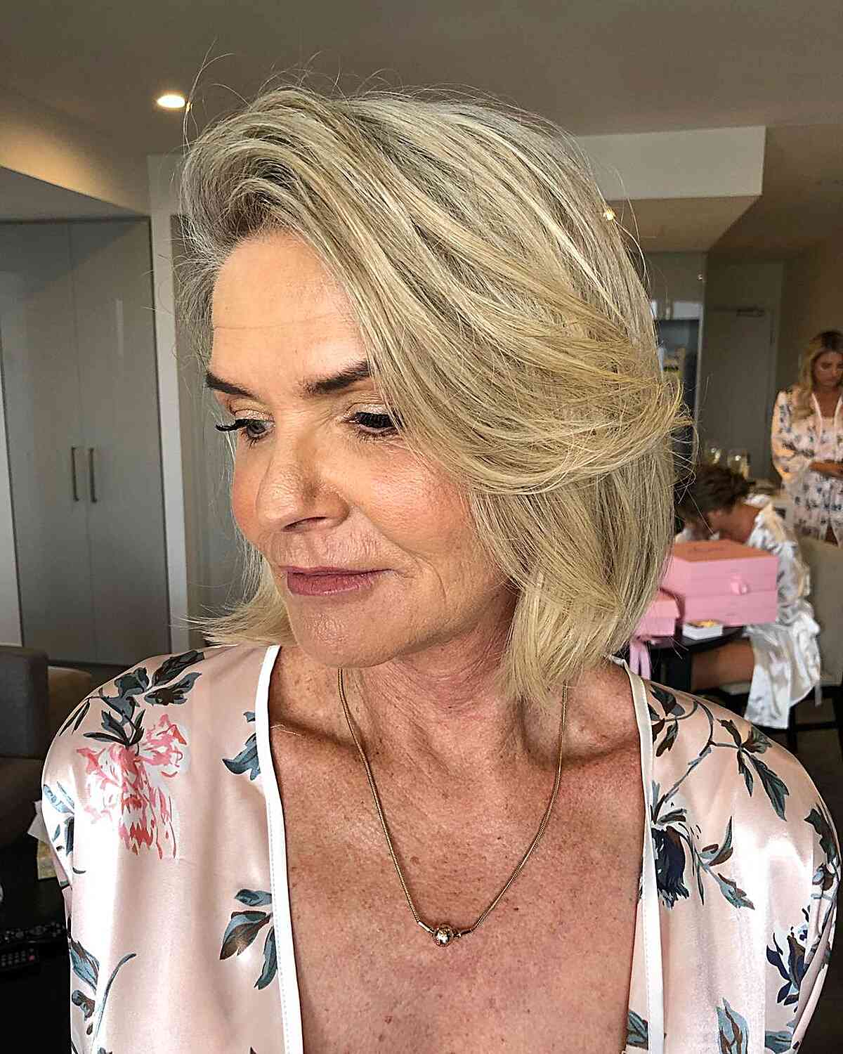 Neck-Length Blonde Lob with a Deep Side Part for Fine-Haired Women in their 50s