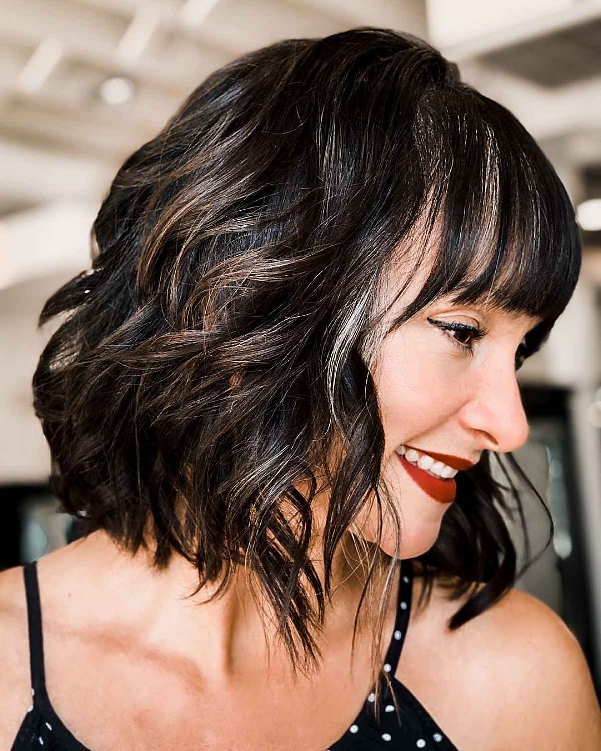 tousled neck-length bob with straight bangs