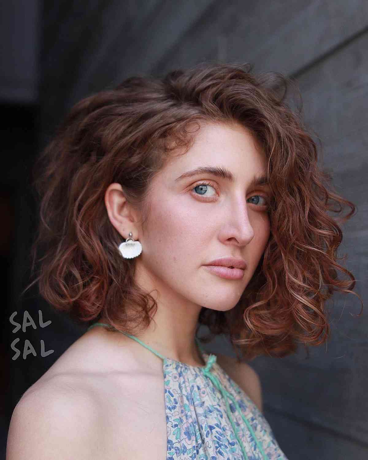 Neck-Length Curly Bob with a Deep Side Part