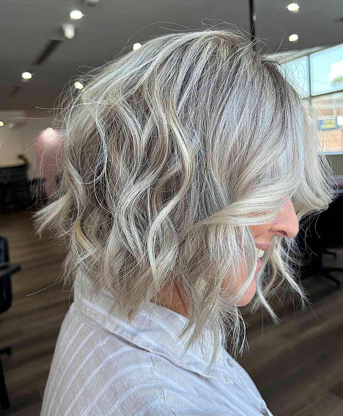 Neck-Length Dimensional Blonde Textured Bob Styled with Messy Waves