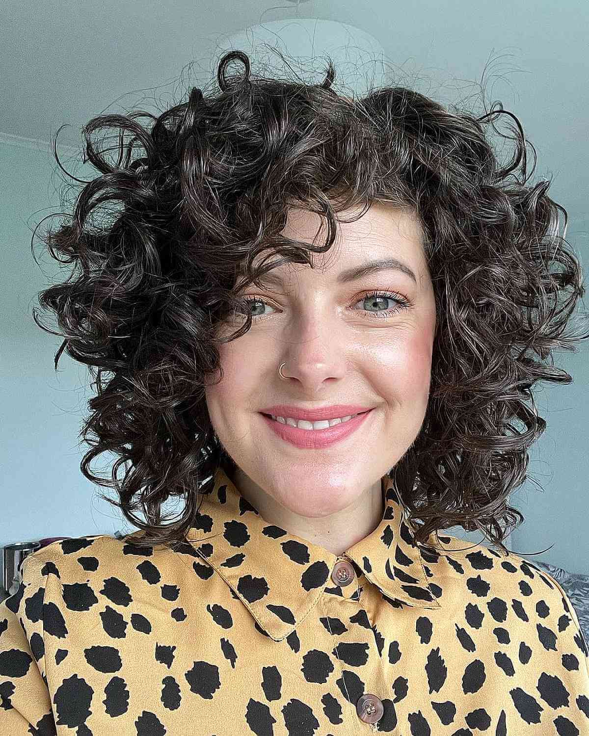 Neck-Length Puffy Haircut with Big Curls