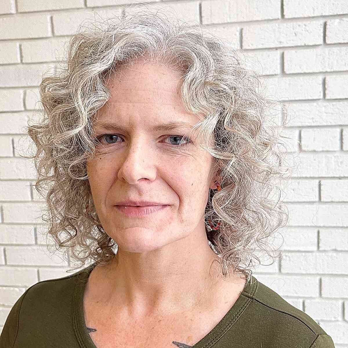 Neck-Length White Curly Shag Bob on 60-year-old Ladies with Square Faces