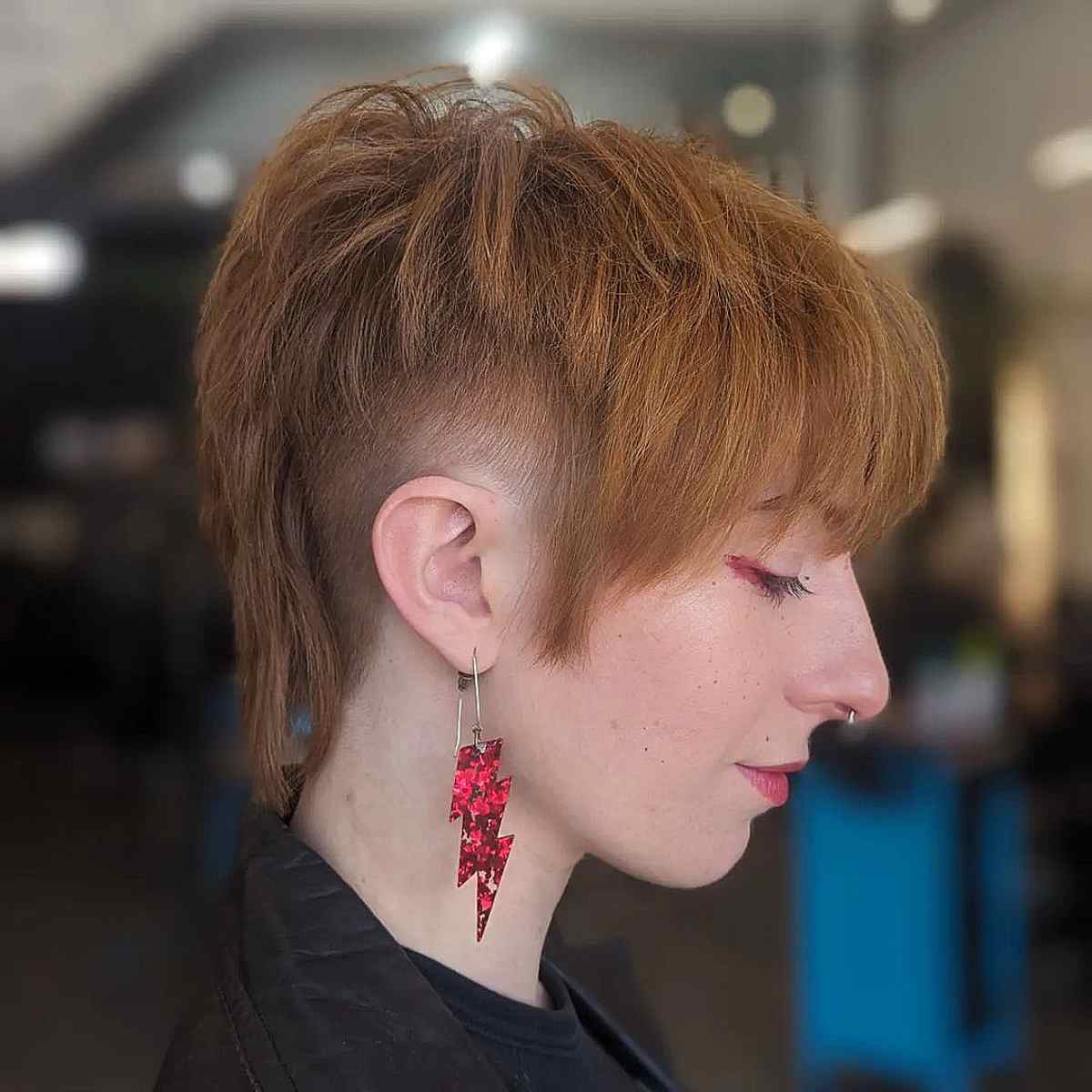Copper mullet with undercut and blunt bangs on fine to medium hair