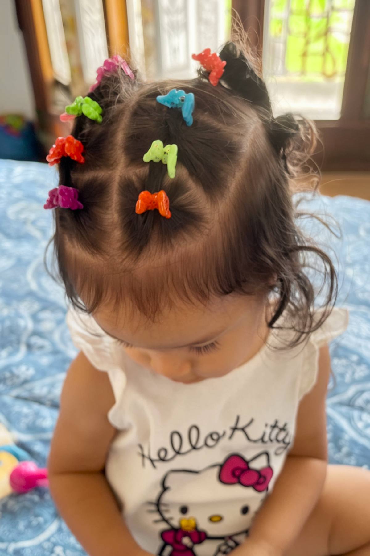 Toddler hairstyle with butterfly clips and twists