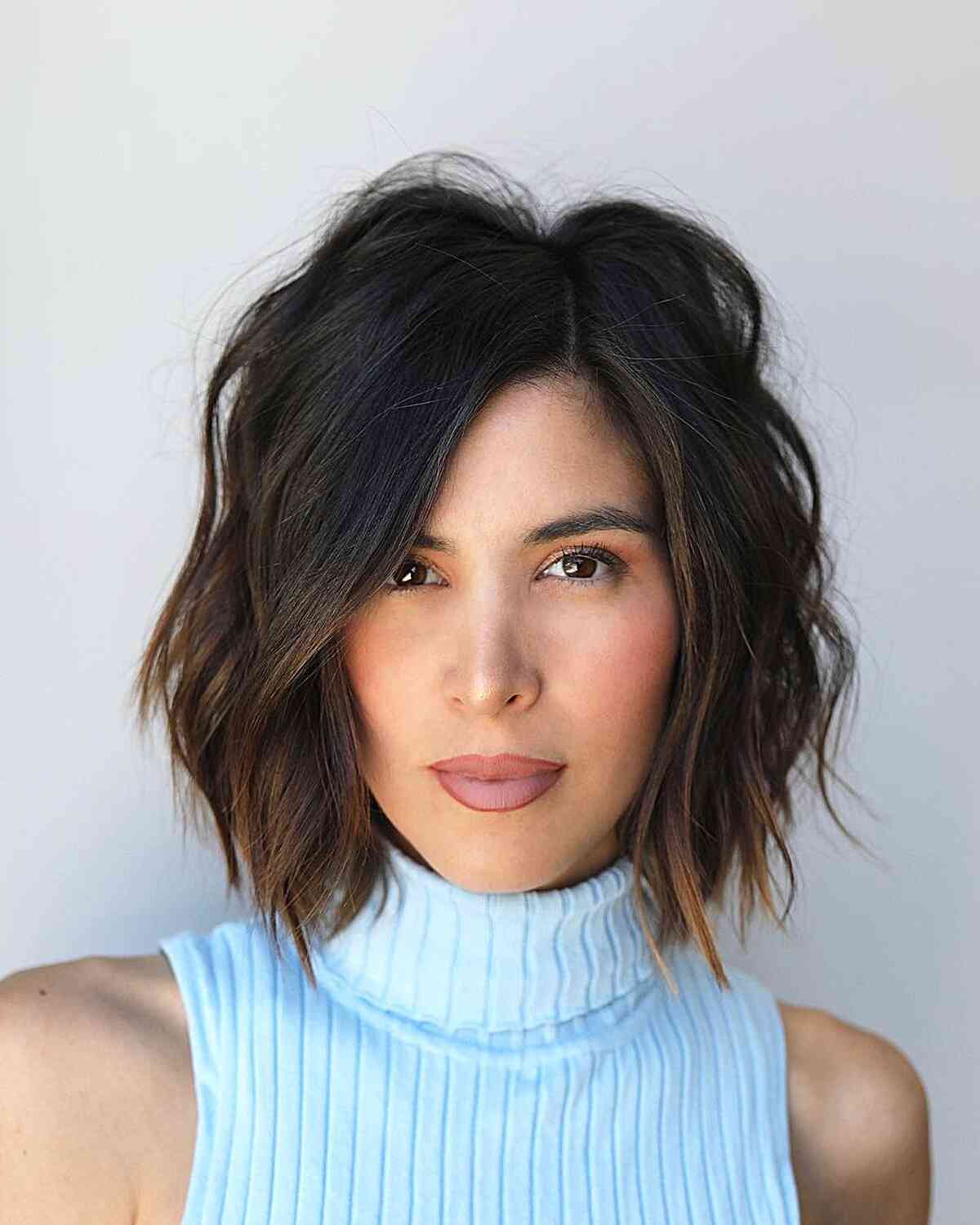 Off Center Parting on a Wispy Above-the-Shoulder Bob