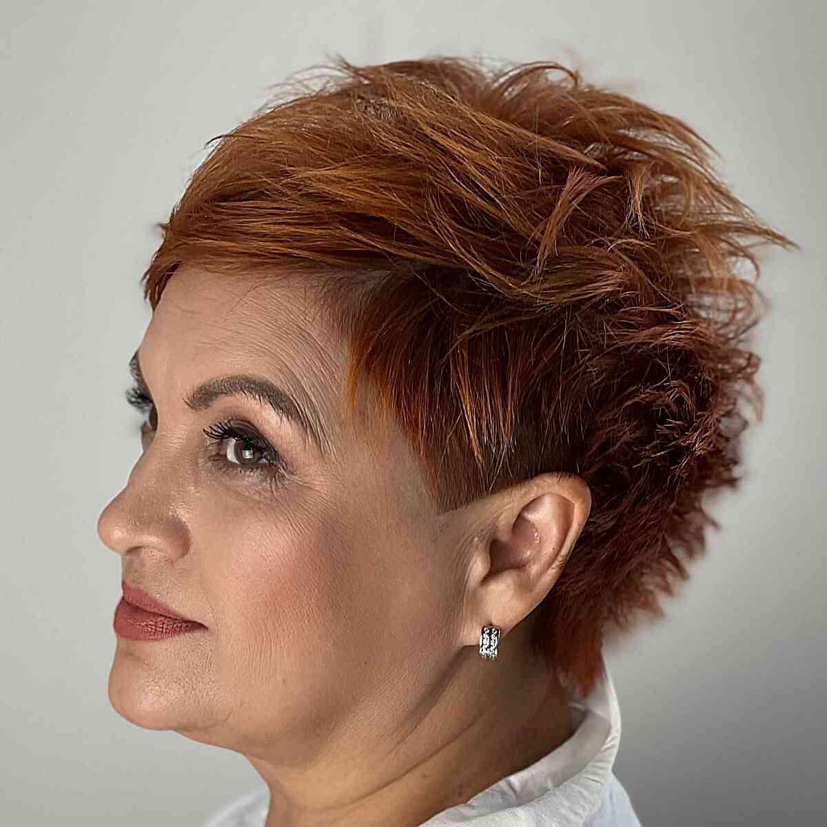 Older Woman's Tousled Dark Copper Short Hair