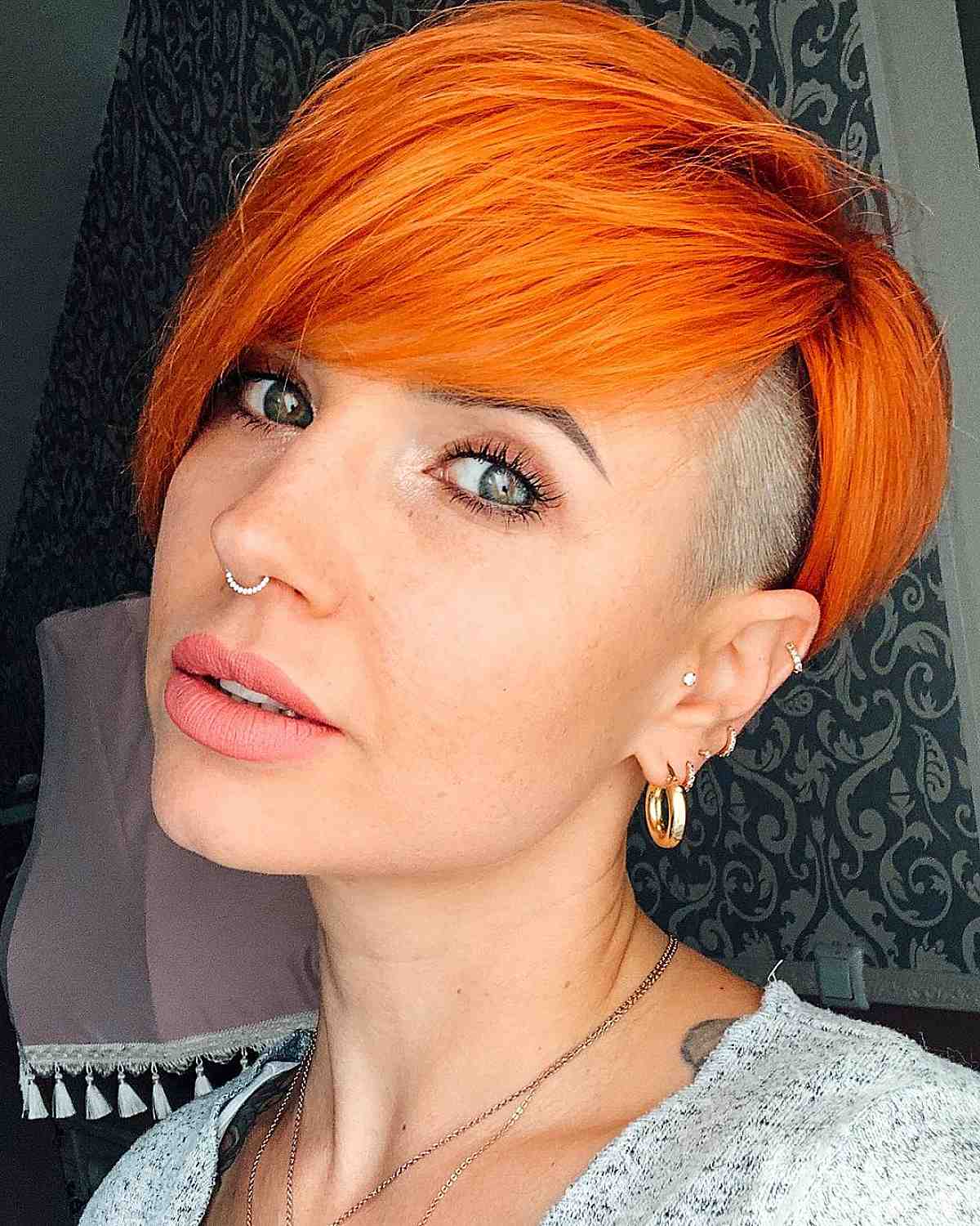 orange pixie with long bangs