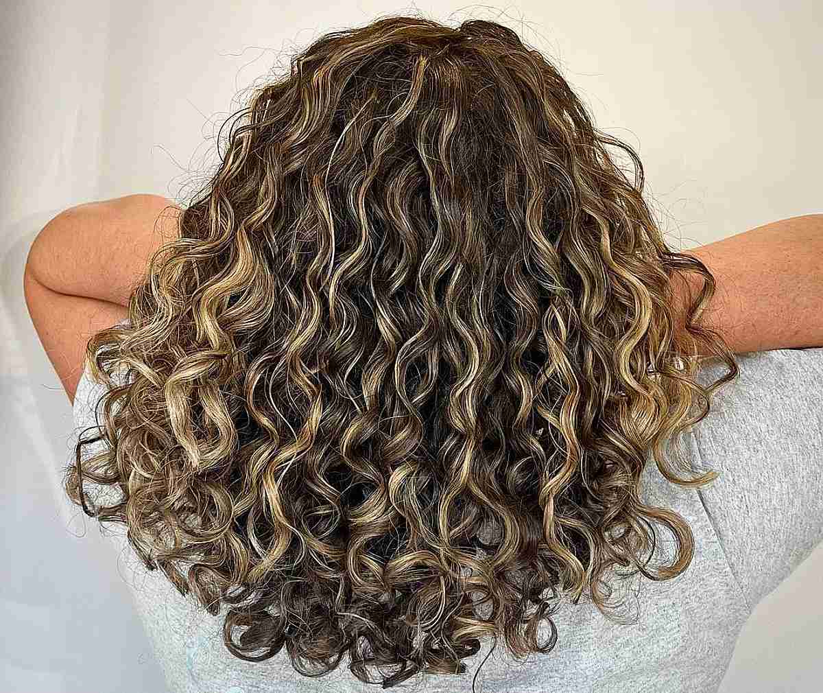 Partial Blonde Balayage Highlights on Soft Curly Hair