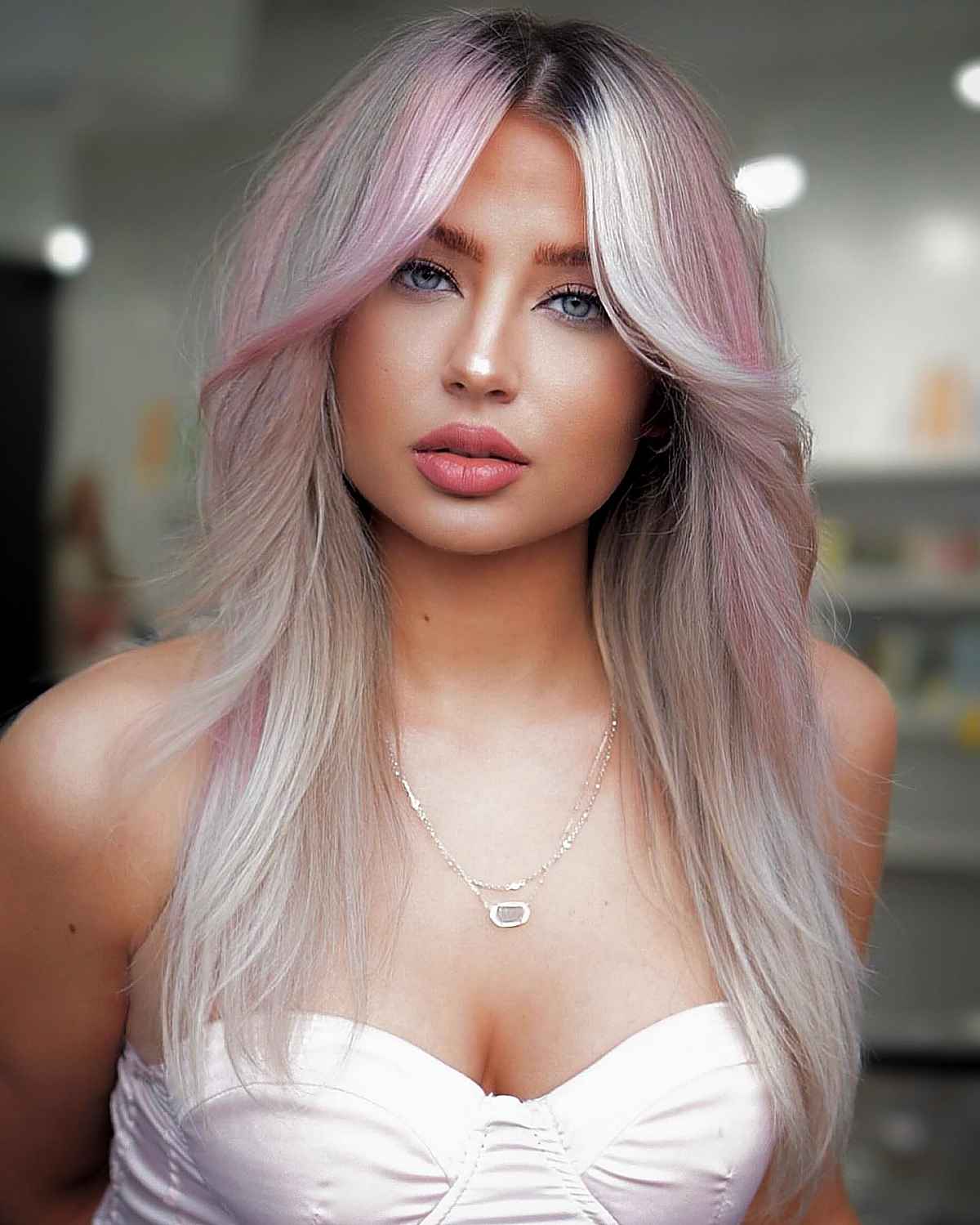 pastel pink hair color with dark roots