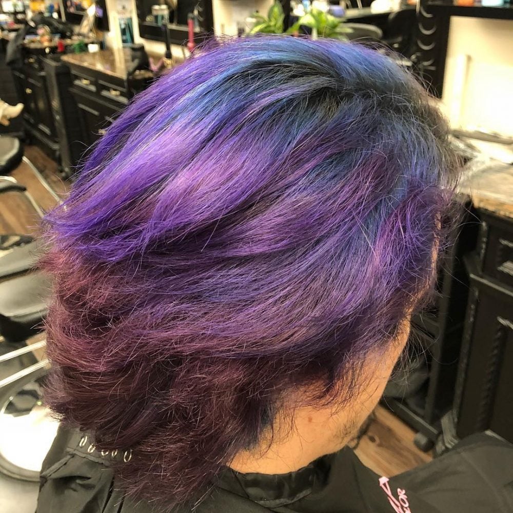 A bright purple and blue hair color melt