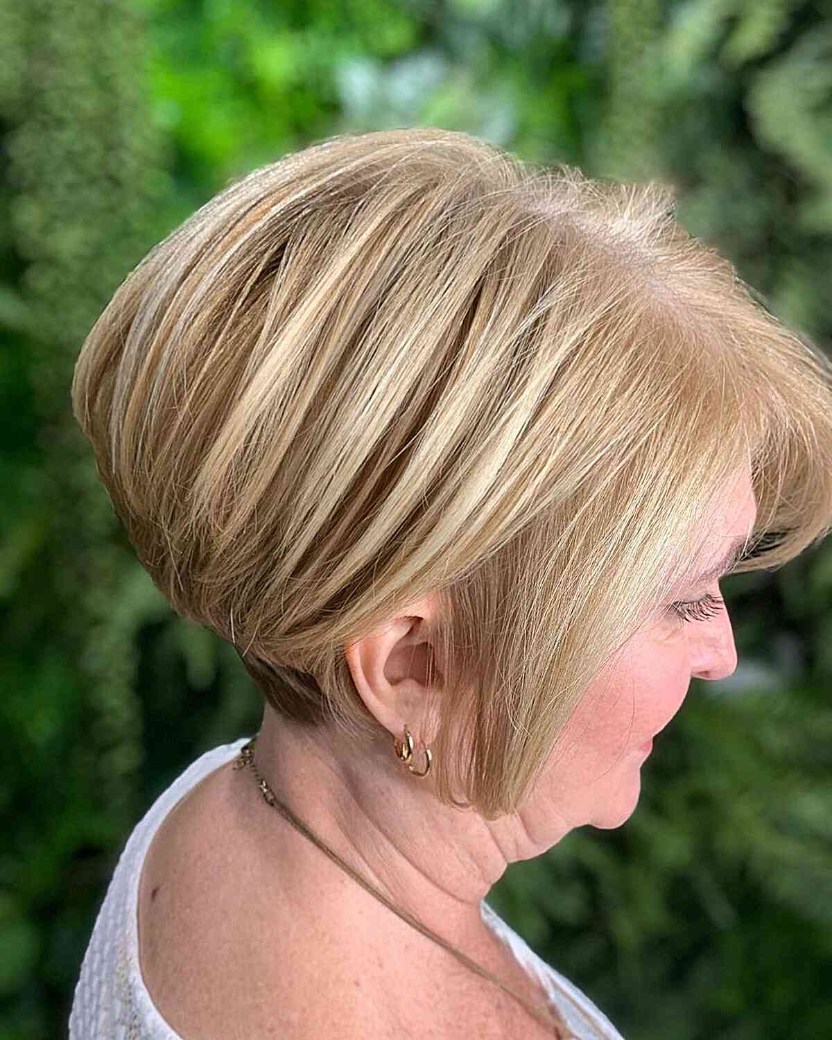 Perfectly Layered Stacked Bob Cut with blonde balayage and an undercut 