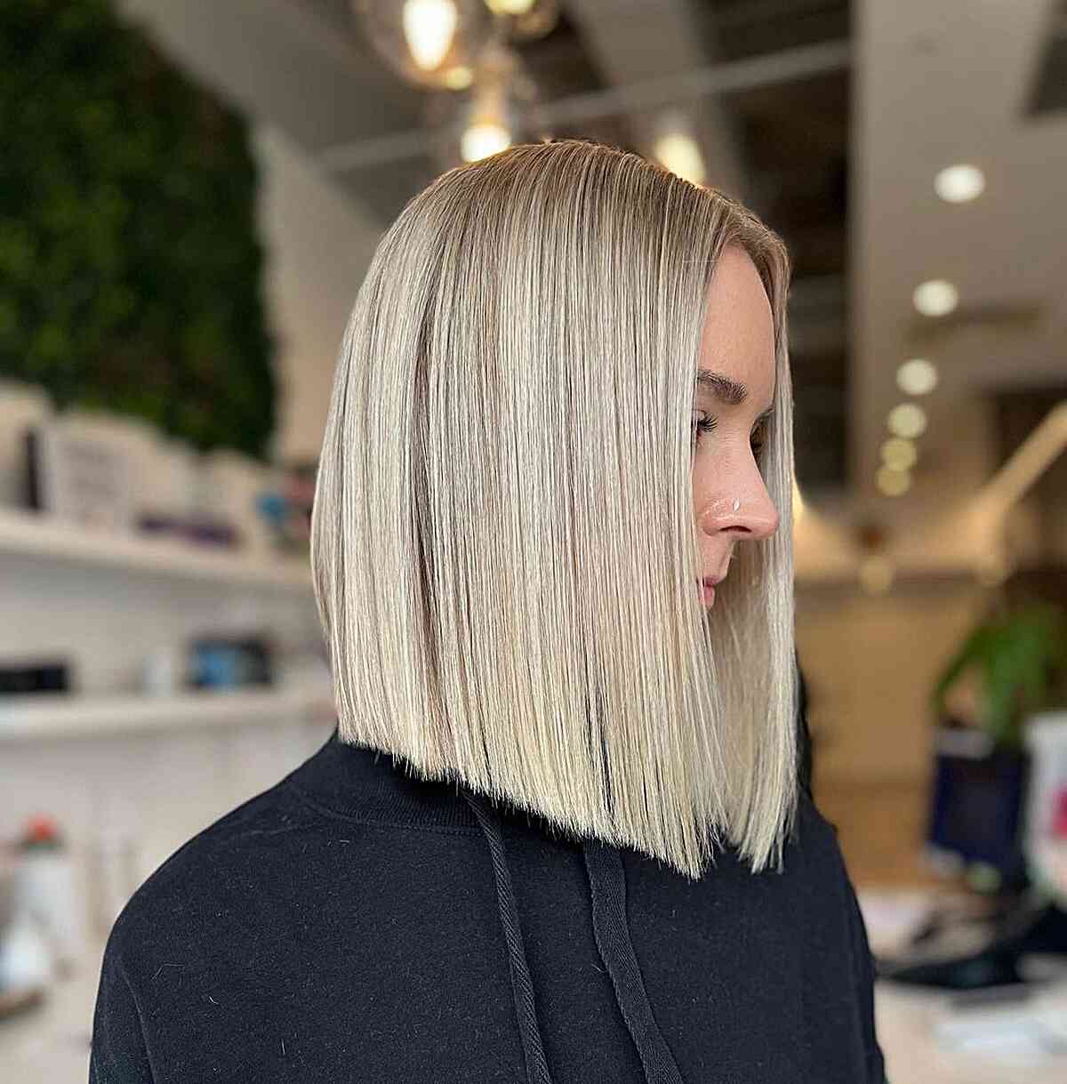 Picture of a perfectly straight ash blonde shoulder length hair
