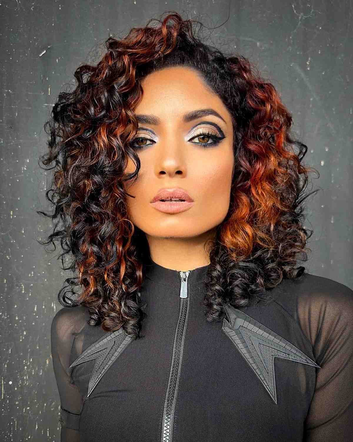 Phoenix-Inspired Mid-Length Curls for Square Faces