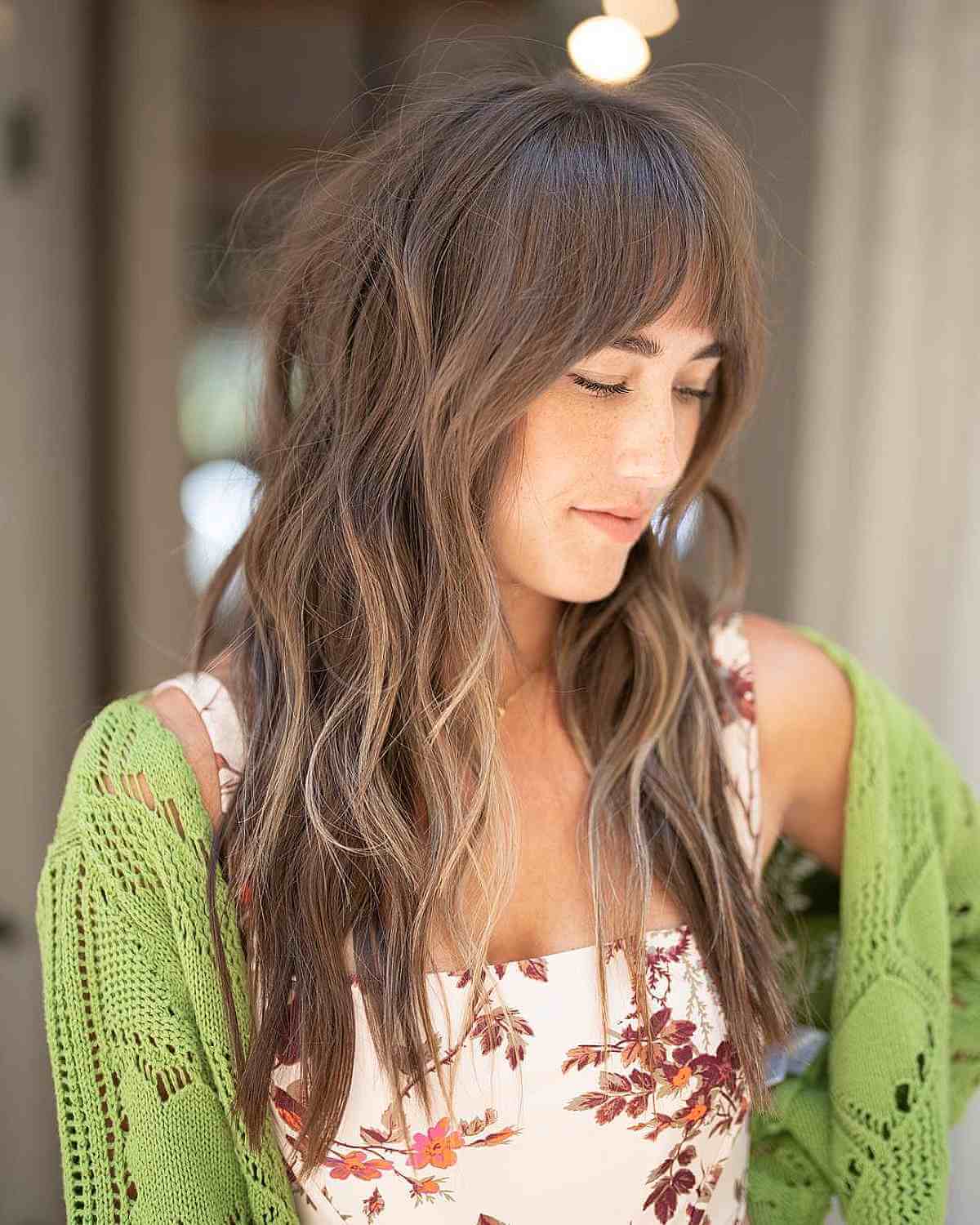 Piece-y Choppy Layers with Wispy Bangs for a Long Face Shape