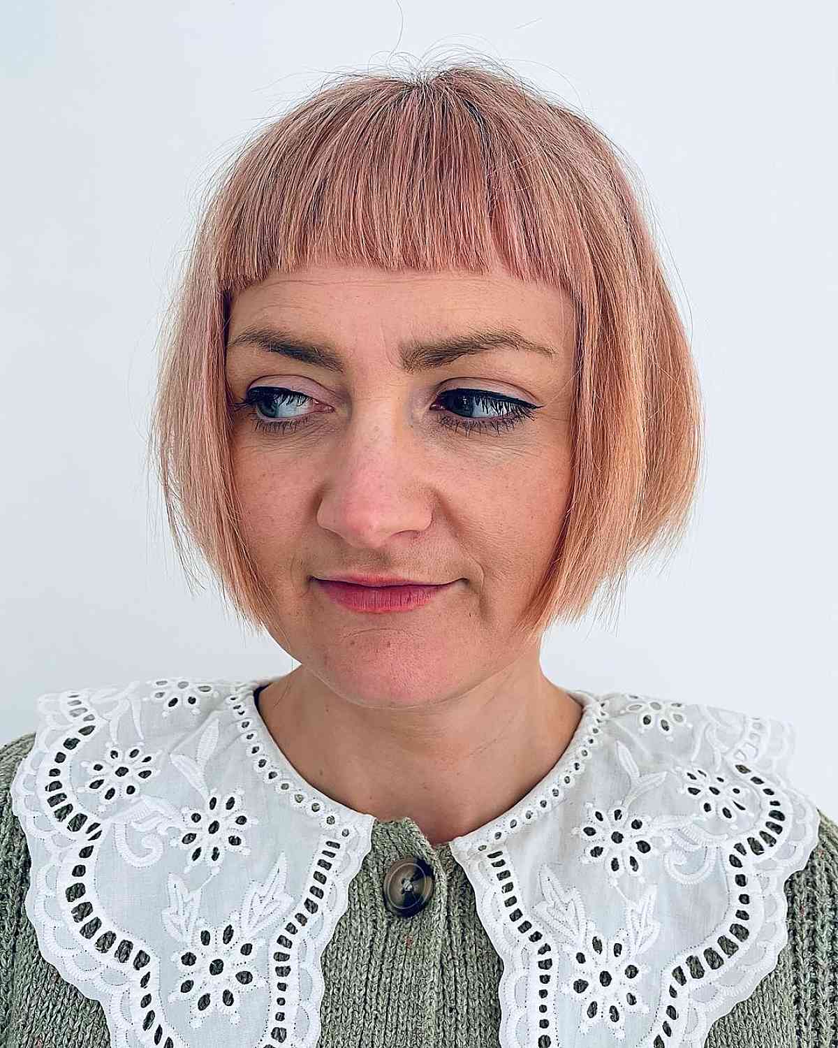 pink and red chin-length blunt bob