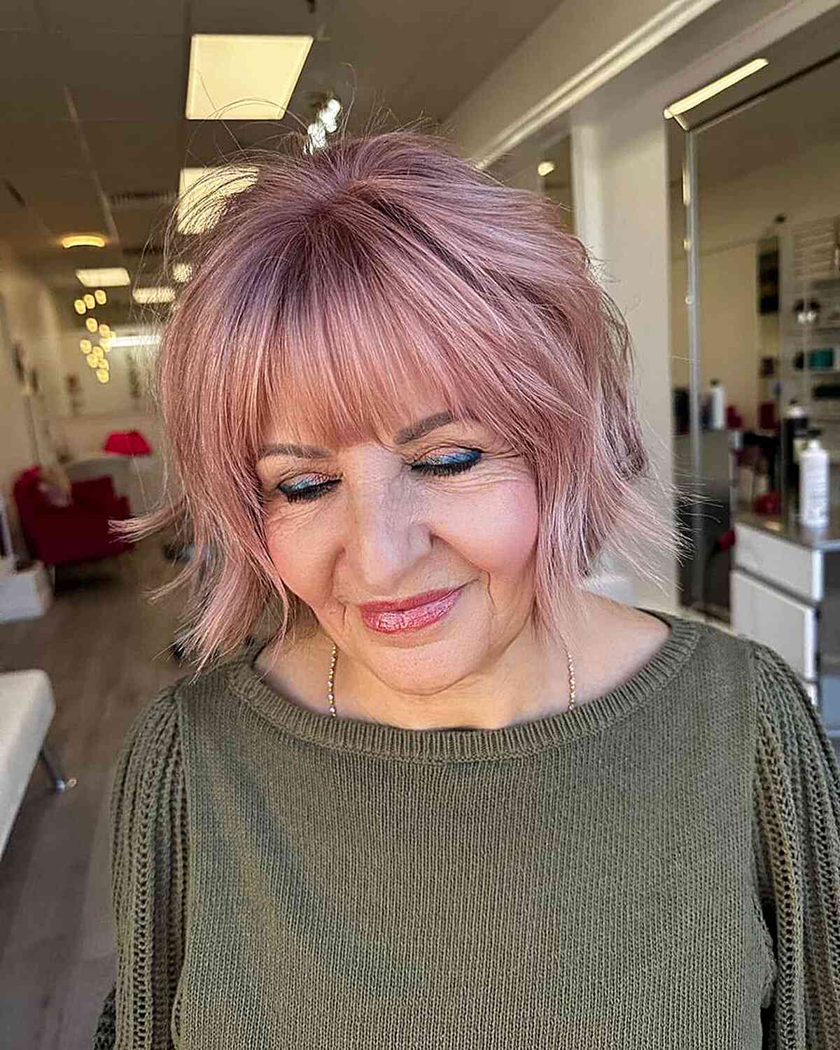 Jaw-Length Pink Bob with Textured Layers and Straight Bangs for Women Over 60