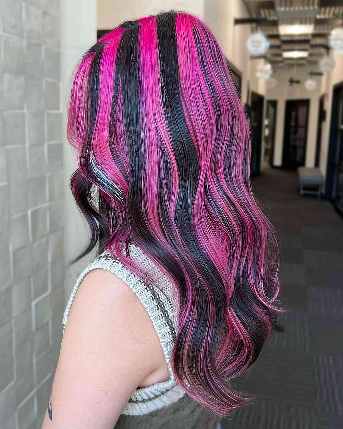 Pink Skunk Highlights on Mid-Long Wavy Black Hair