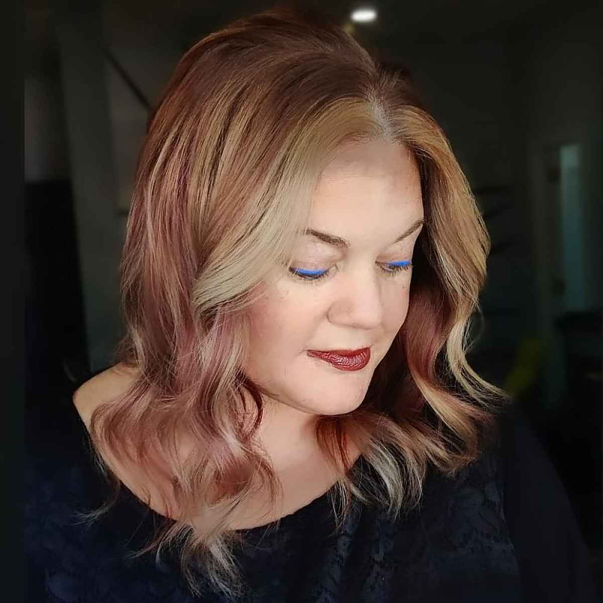 pinot noir with face-framing beige blonde highlights fall hair color for grandma
