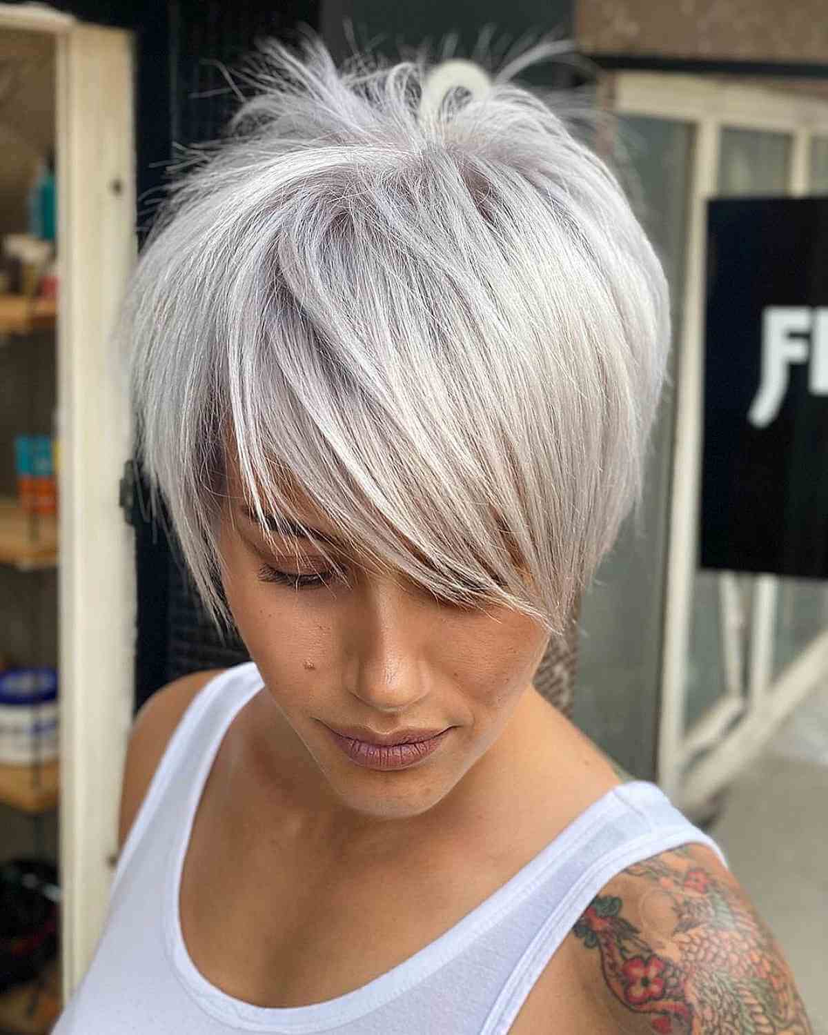 Pixie Cut With Platinum Blonde Hair for a Heart Face