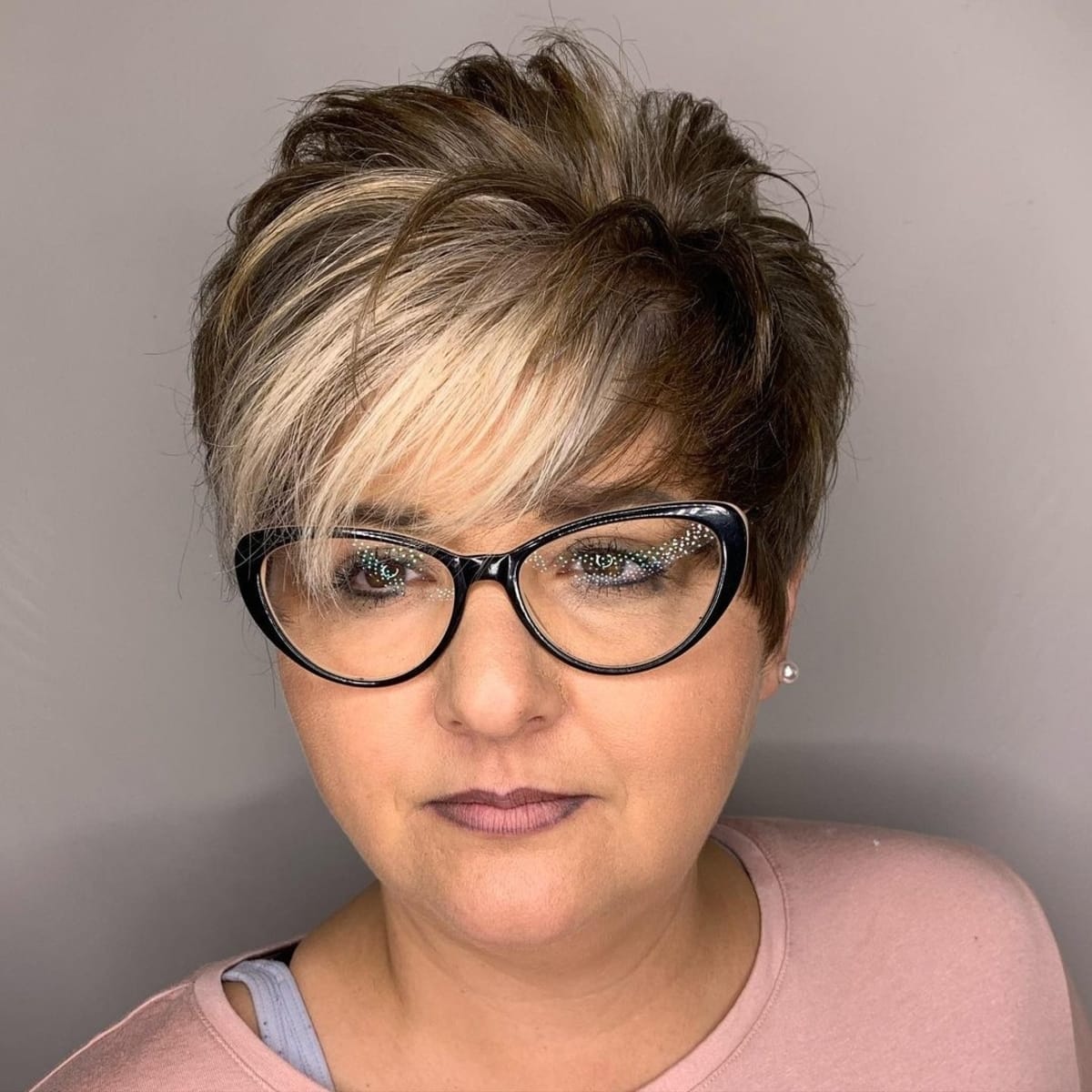 Pixie hairstyle for older women with glasses