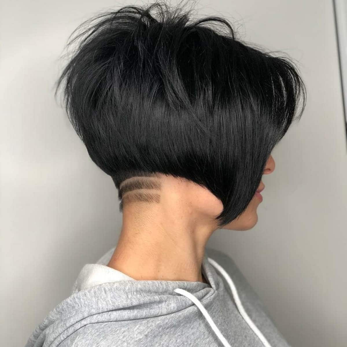 Pixie Undercut Bob with Long Bangs and a Shaved Line Design