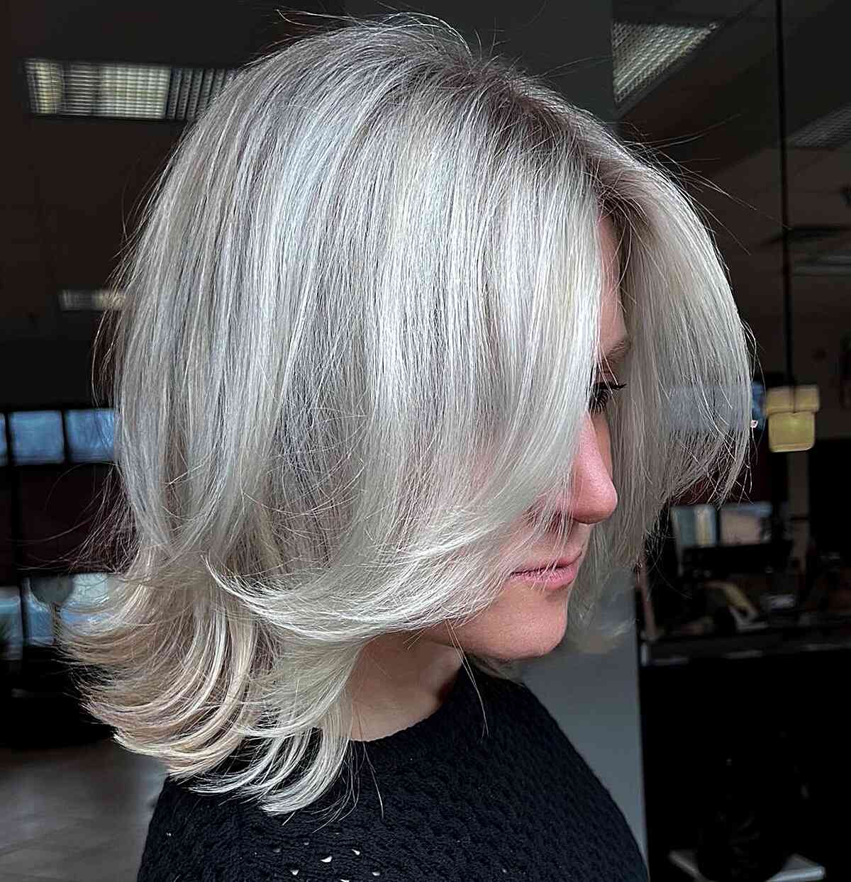 Platinum Blonde Lob with Feathered Ends and Long Bangs