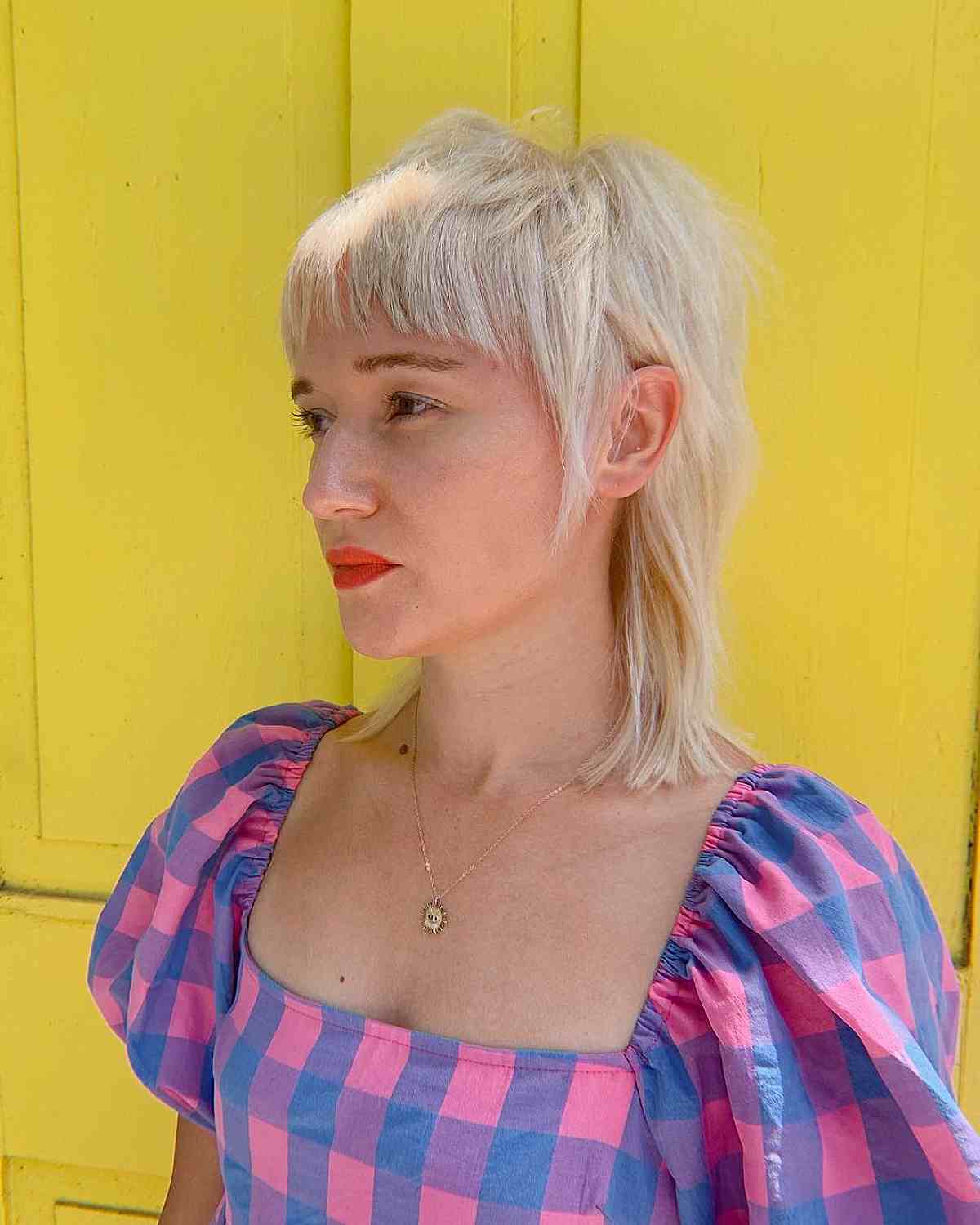 Platinum Blonde Shaggy Mullet Hairstyle with Bangs