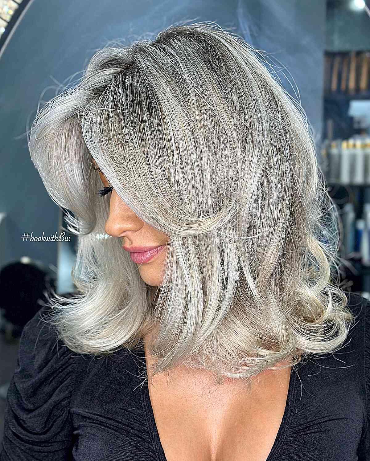Platinum Grey with a Shadow Root on Medium-Length Feathered Hair