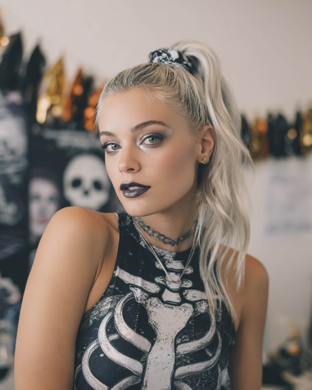 Platinum high ponytail with scrunchie, edgy Halloween hairstyle with gothic makeup