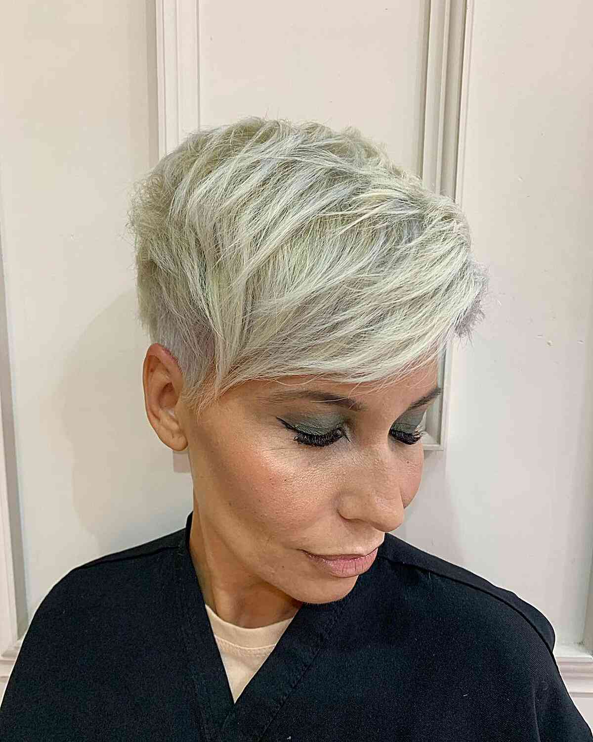 Platinum Pixie with an Undercut and Sweeping Bangs for women with long faces