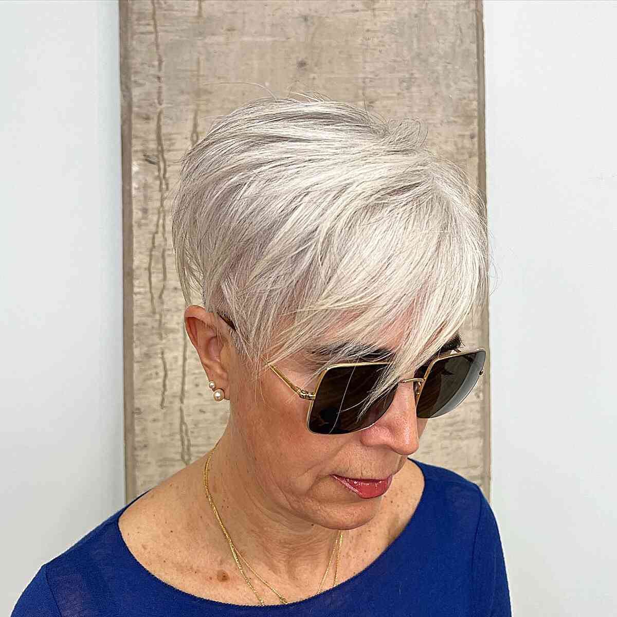 Platinum Pixie with Short Layers and sweeping fringe on older women