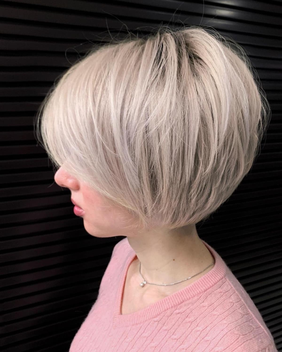 Platinum stacked bob with side-swept bangs