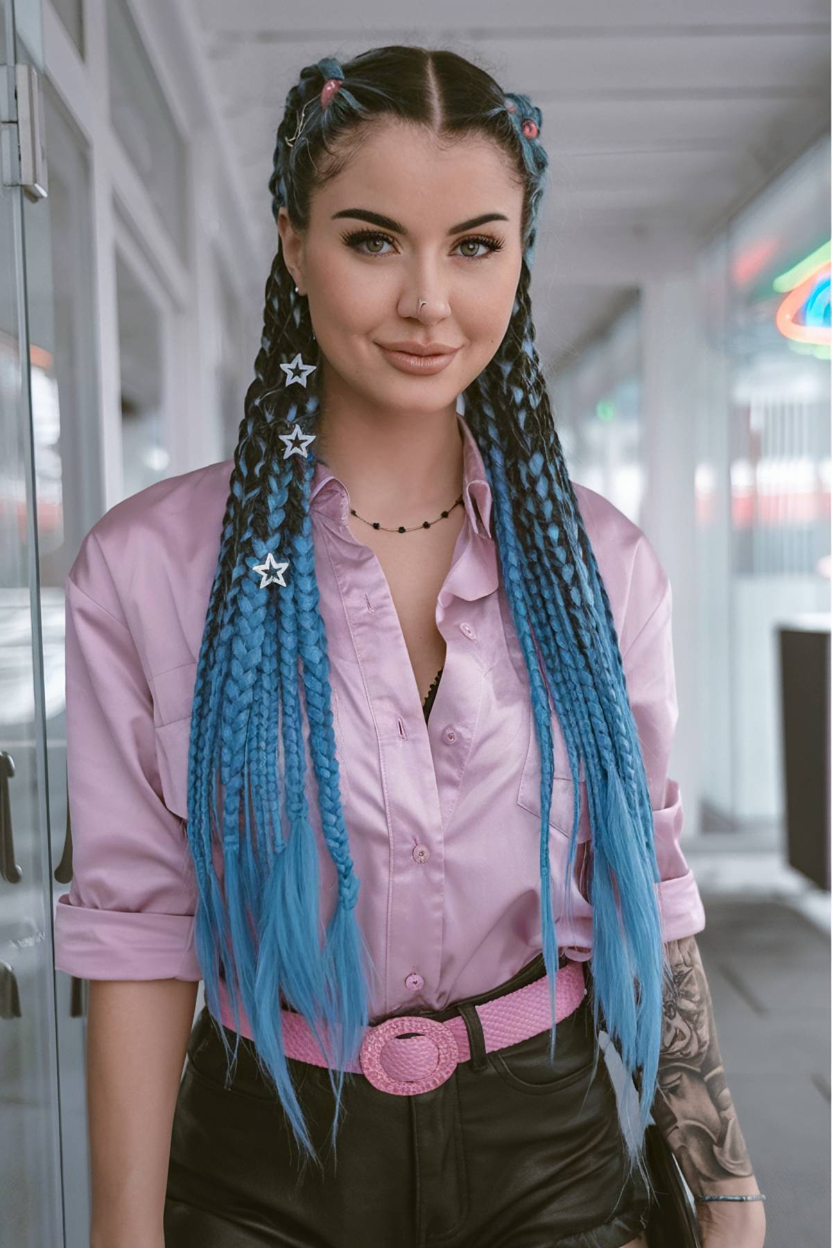 Playful rave hairstyle with colorful braids and fun hair accessories