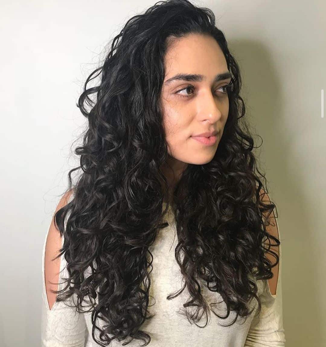 Long Soft Curls with Side-Swept Bangs for Fine and Wavy Hair