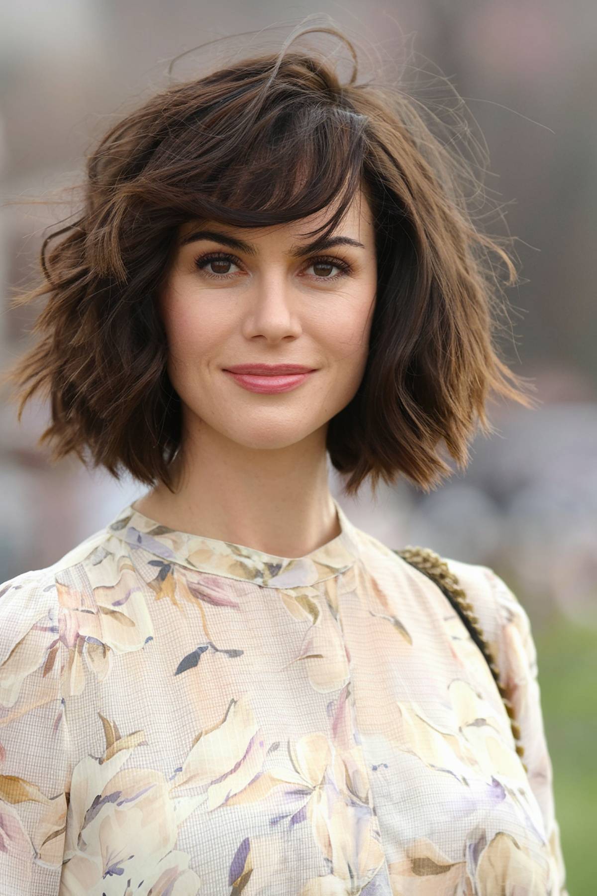 Short soft shag haircut with choppy layers and wispy bangs