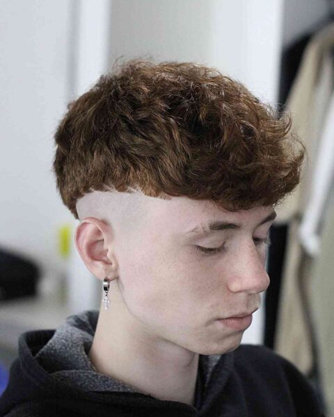 A Precision Bald Fade with a Messy Top for Teen boys